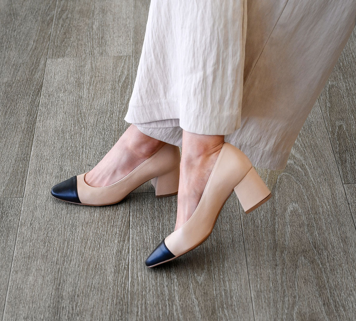 Beige High-Heel Pump with Black Cap Toe